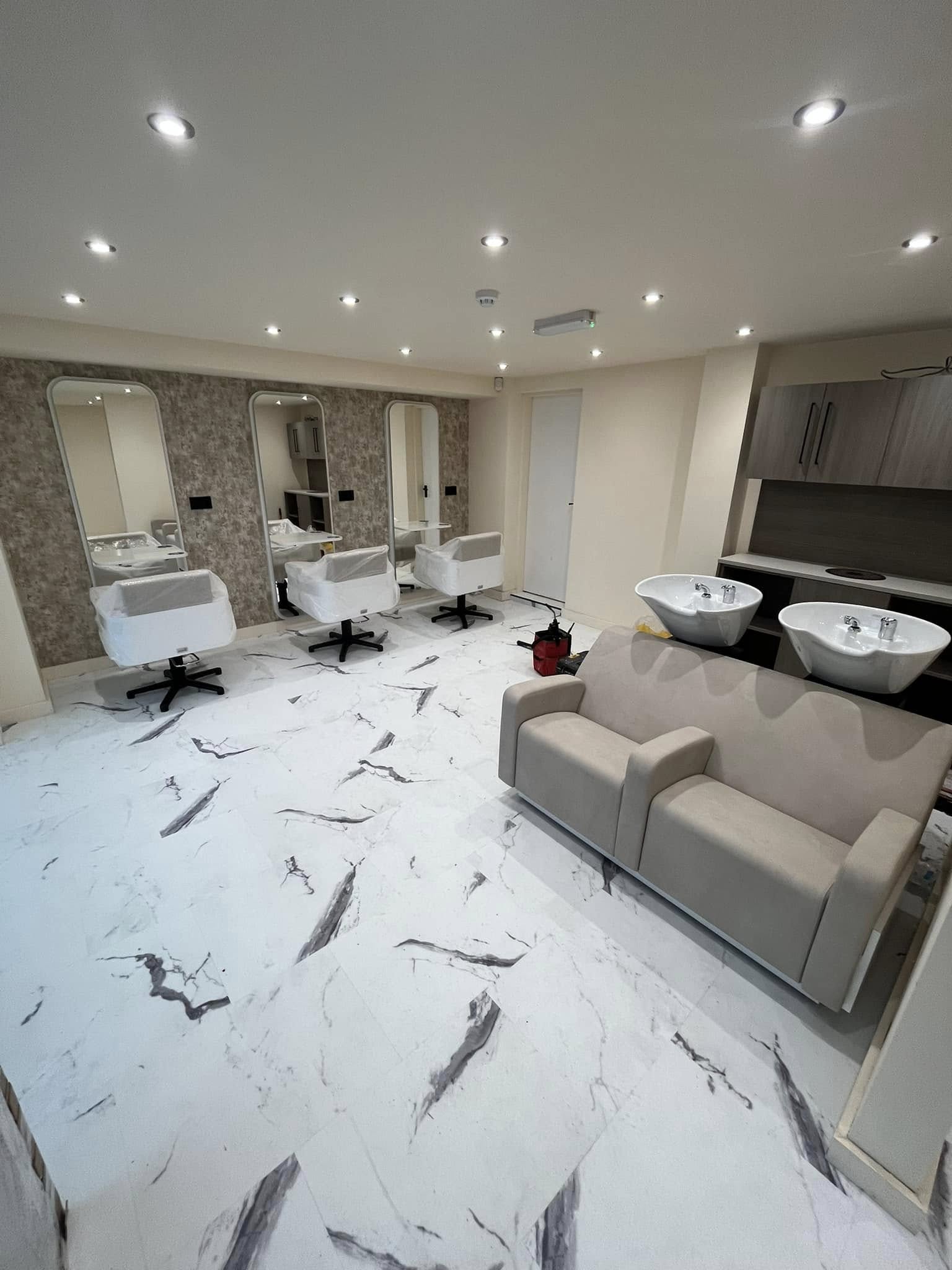 Compact cloakroom with marble floor and grey vanity unit